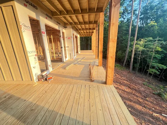 a view of balcony with wooden floor and outer view