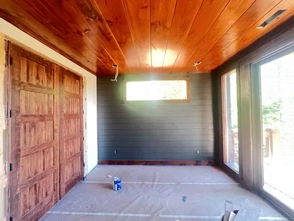 a view of a porch with wooden floor and outdoor space
