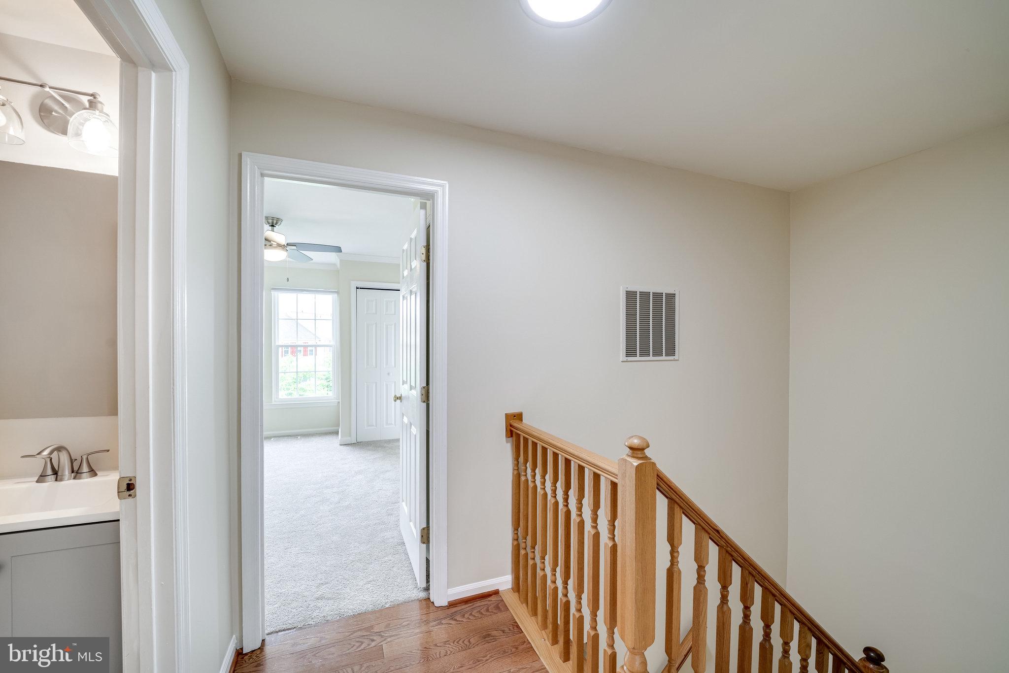 6007 Bingley Road Alexandria, VA 22315 - Photo 27 of 70 View from upper level hallway into primary bedroom