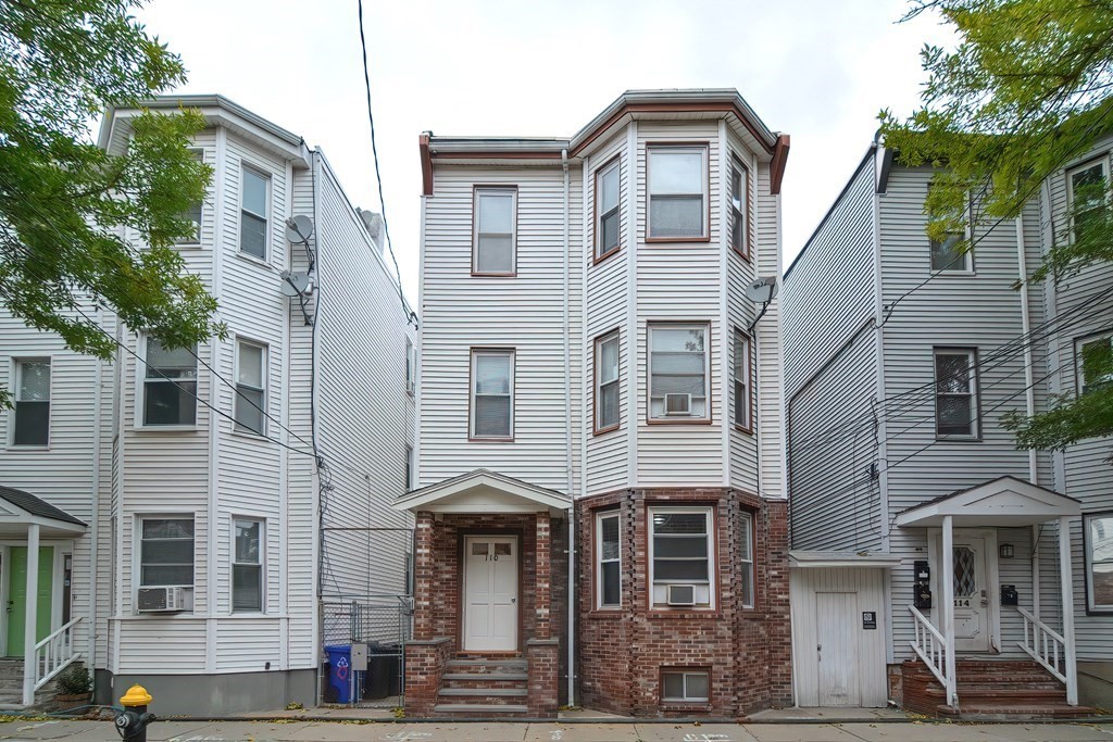 110 Everett Street Boston, MA 02128 - Photo 1 of 41 a front view of a building with street