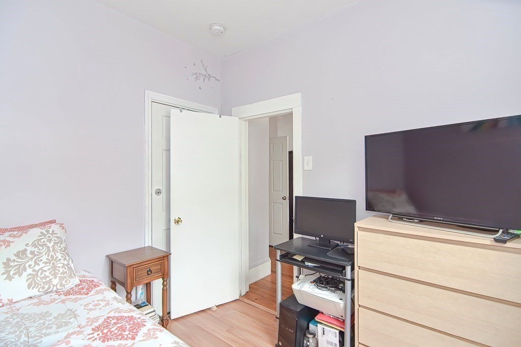 110 Everett Street Boston, MA 02128 - Photo 18 of 41 a room with bed and a table
