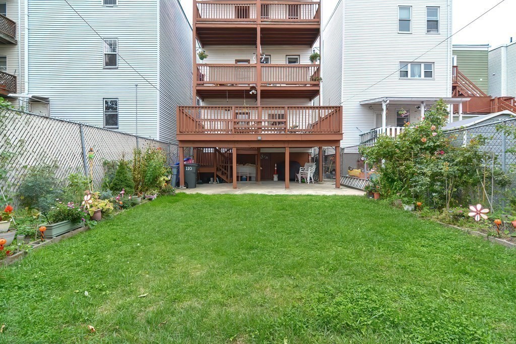 110 Everett Street Boston, MA 02128 - Photo 38 of 41 a view of a house with a yard and sitting area