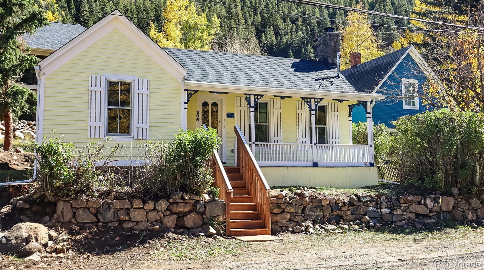 906 Main Street Georgetown, CO 80444 - Photo 1 of 26 a front view of a house with garden