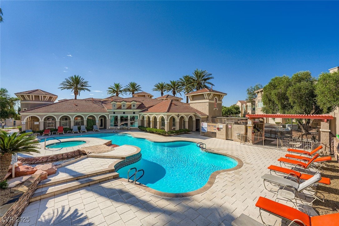 10550 West Alexander Road, Unit 2219 Las Vegas, NV 89129 - Photo 28 of 29 Community pool with a community hot tub and a patio area