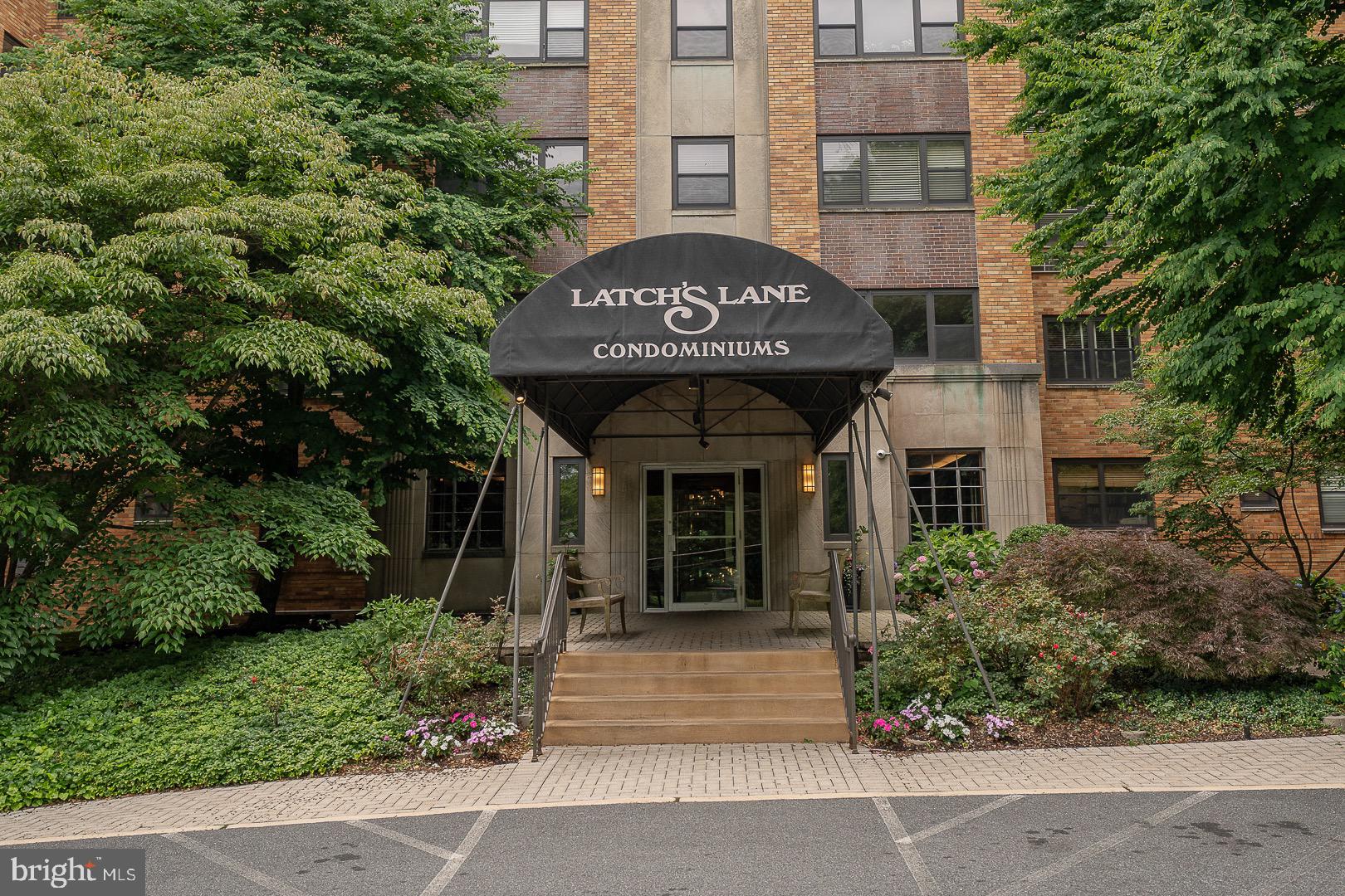 a front view of a building with garden