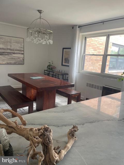 40 Old Lancaster Road, Unit 512 Merion Station, PA 19066 - Photo 14 of 60 a bedroom with a bed and a chandelier