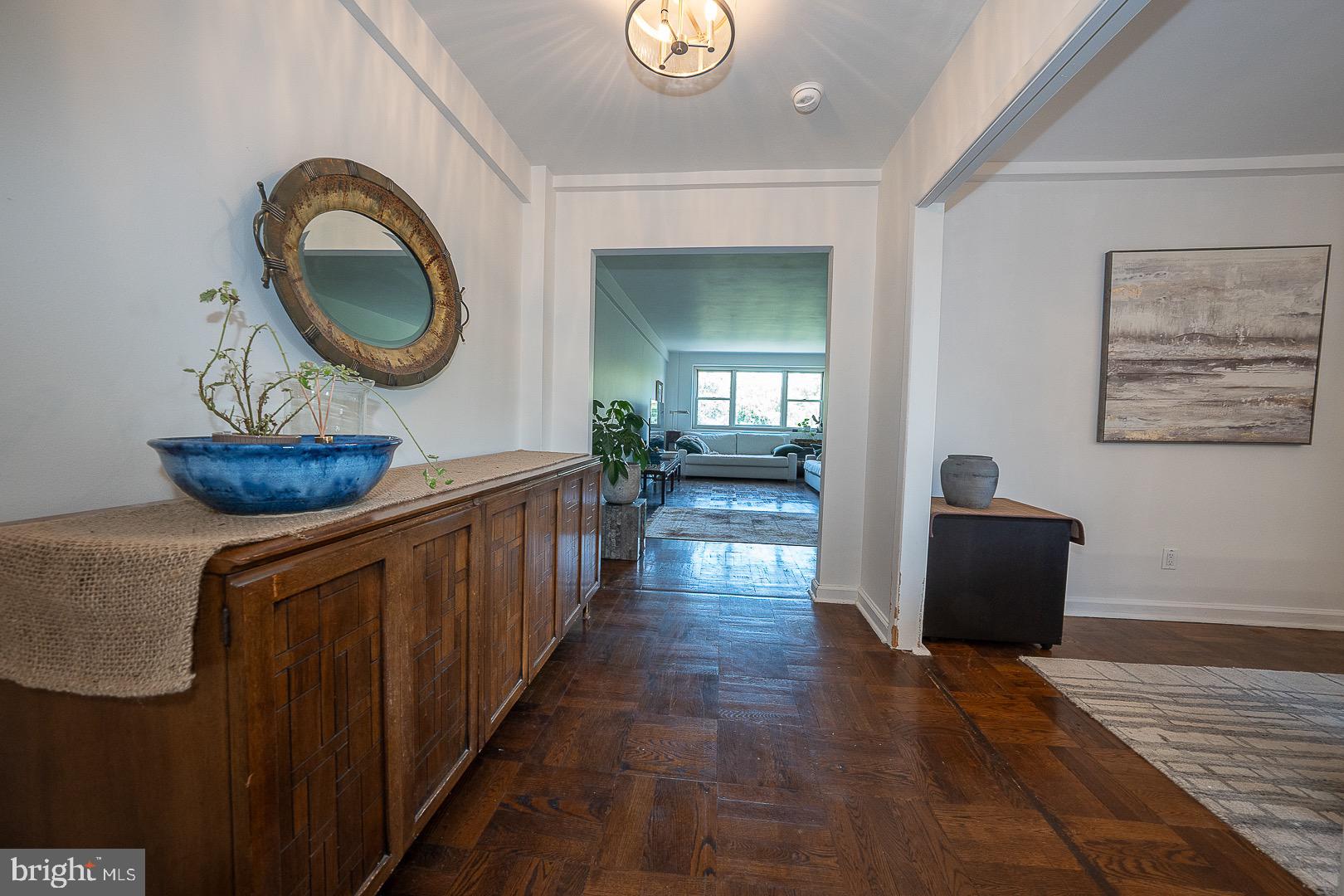40 Old Lancaster Road, Unit 512 Merion Station, PA 19066 - Photo 20 of 60 a view of a hallway with wooden floor and a potted plant
