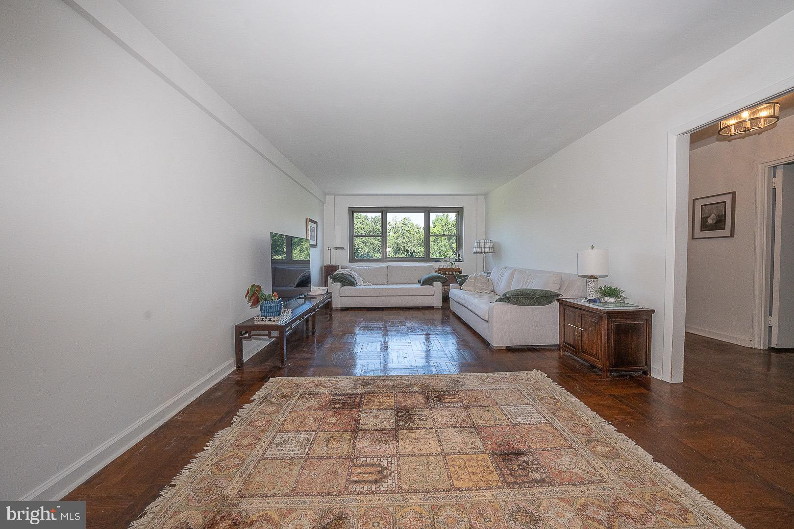40 Old Lancaster Road, Unit 512 Merion Station, PA 19066 - Photo 21 of 60 a living room with furniture and a rug