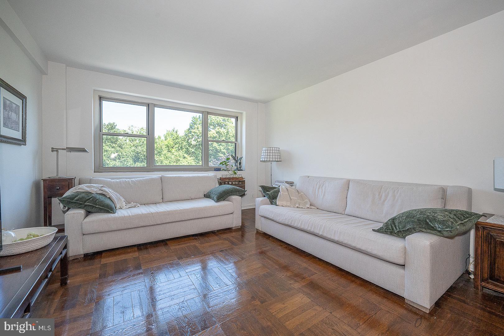 40 Old Lancaster Road, Unit 512 Merion Station, PA 19066 - Photo 24 of 60 a living room with a couch and a large window