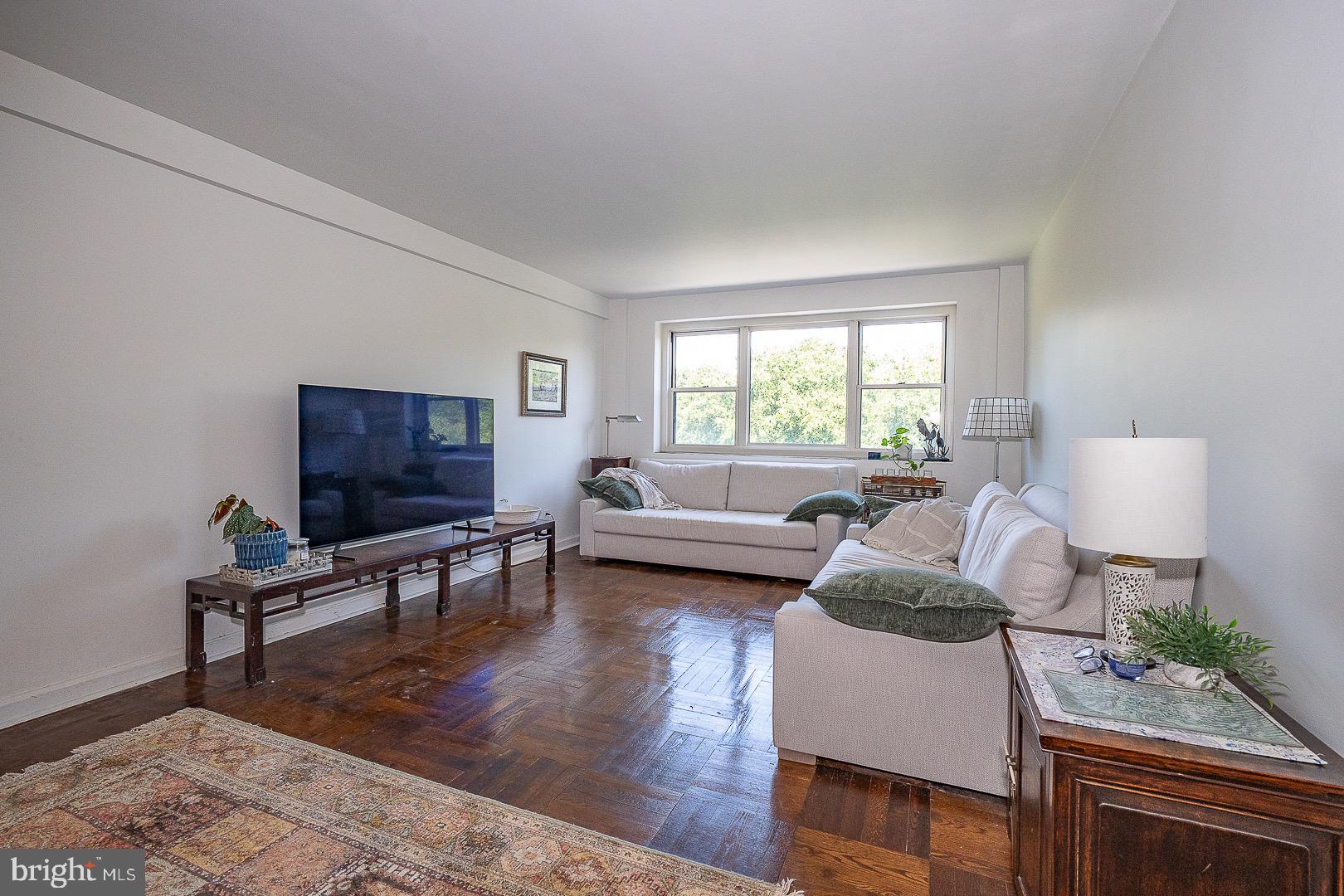 40 Old Lancaster Road, Unit 512 Merion Station, PA 19066 - Photo 25 of 60 a living room with furniture a window and a flat screen tv