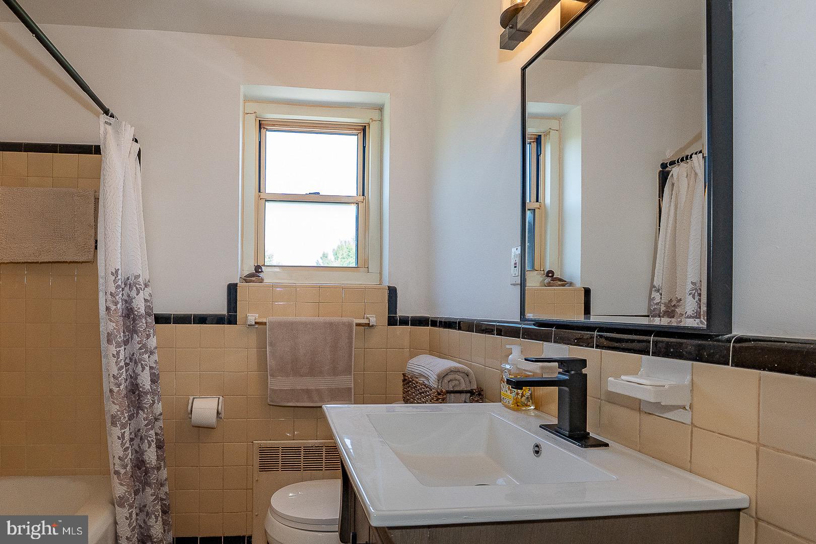 40 Old Lancaster Road, Unit 512 Merion Station, PA 19066 - Photo 27 of 60 a bathroom with a sink toilet and mirror