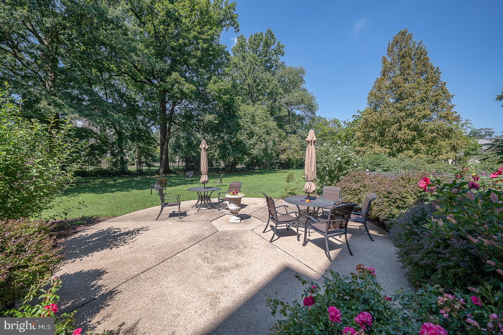40 Old Lancaster Road, Unit 512 Merion Station, PA 19066 - Photo 48 of 60 a view of a backyard with sitting area and garden