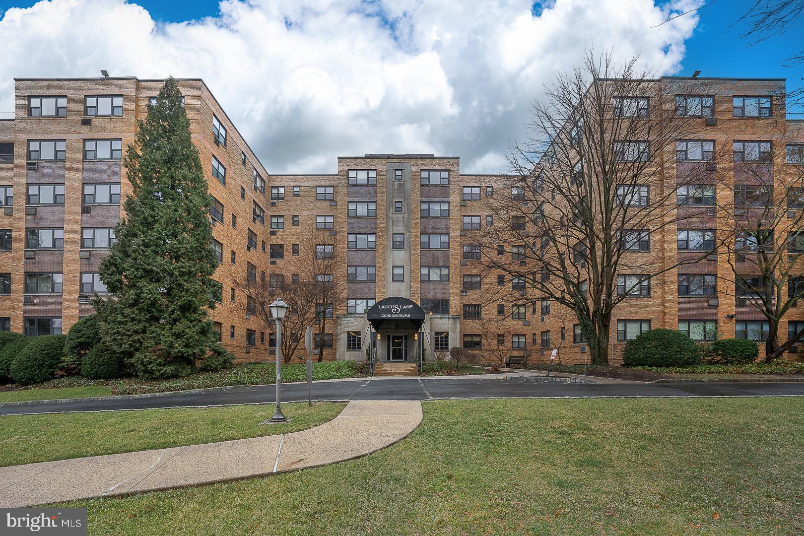 40 Old Lancaster Road, Unit 512 Merion Station, PA 19066 - Photo 54 of 60 a large building with a yard