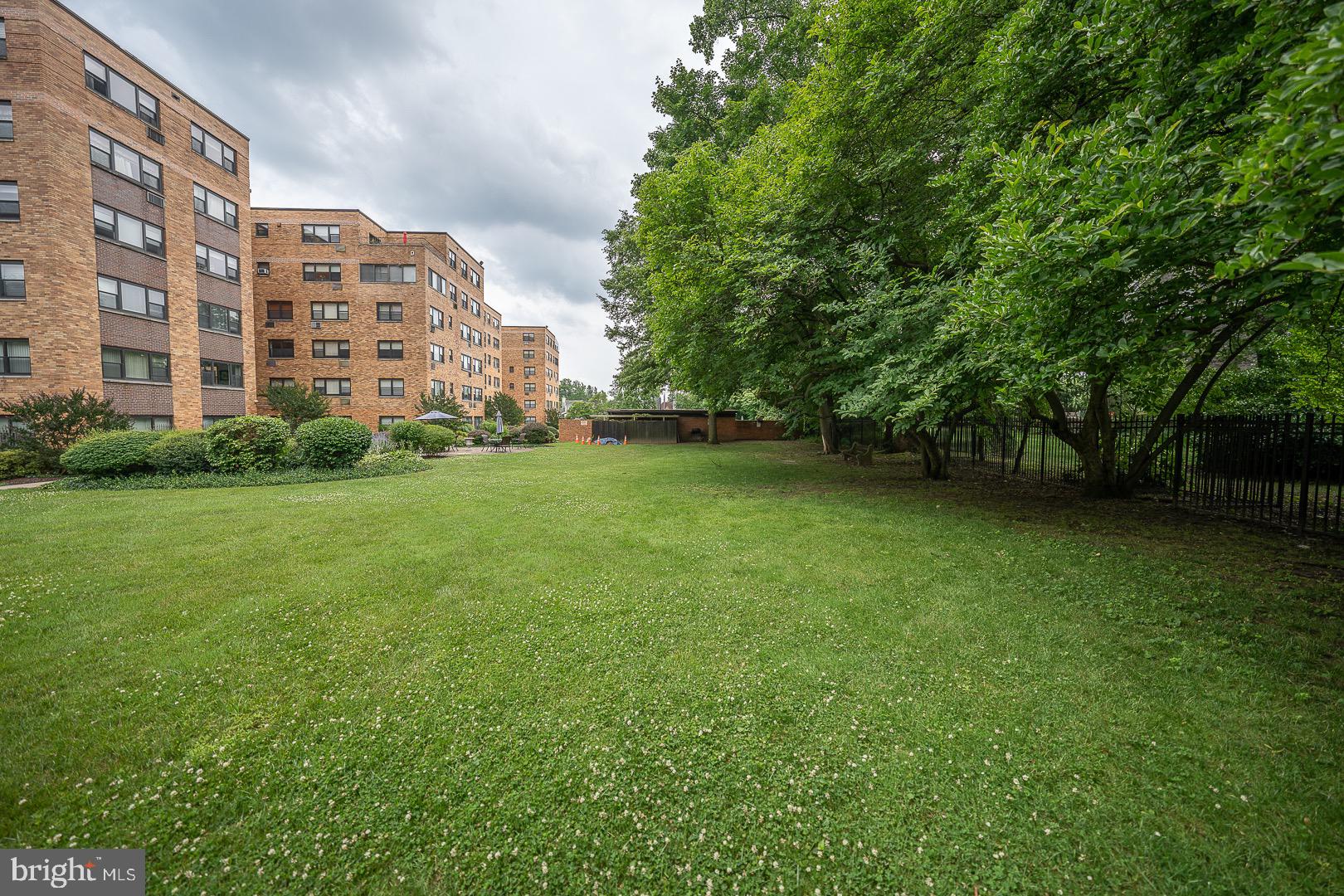 40 Old Lancaster Road, Unit 512 Merion Station, PA 19066 - Photo 55 of 60 a view of a building next to a big yard