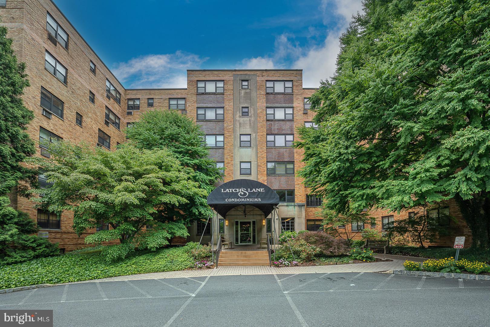 40 Old Lancaster Road, Unit 512 Merion Station, PA 19066 - Photo 57 of 60 a front view of a building with garden