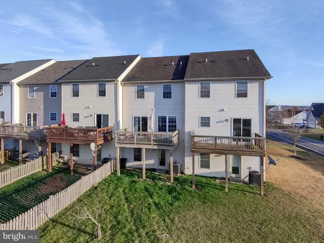 a aerial view of a house with a yard
