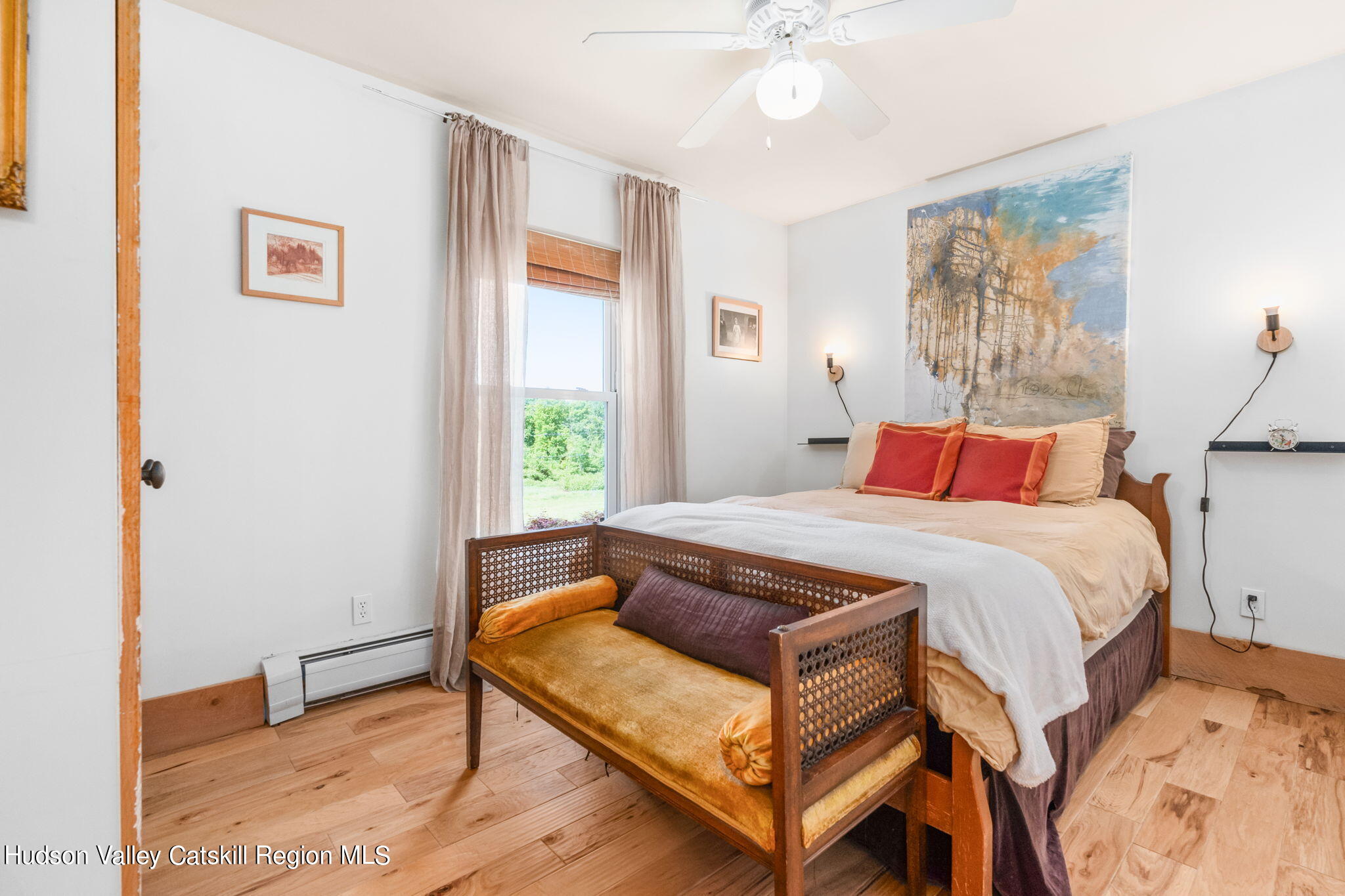 67 Jaycox Road Medusa, NY 12120 - Photo 19 of 36 a bedroom with a bed and wooden floor