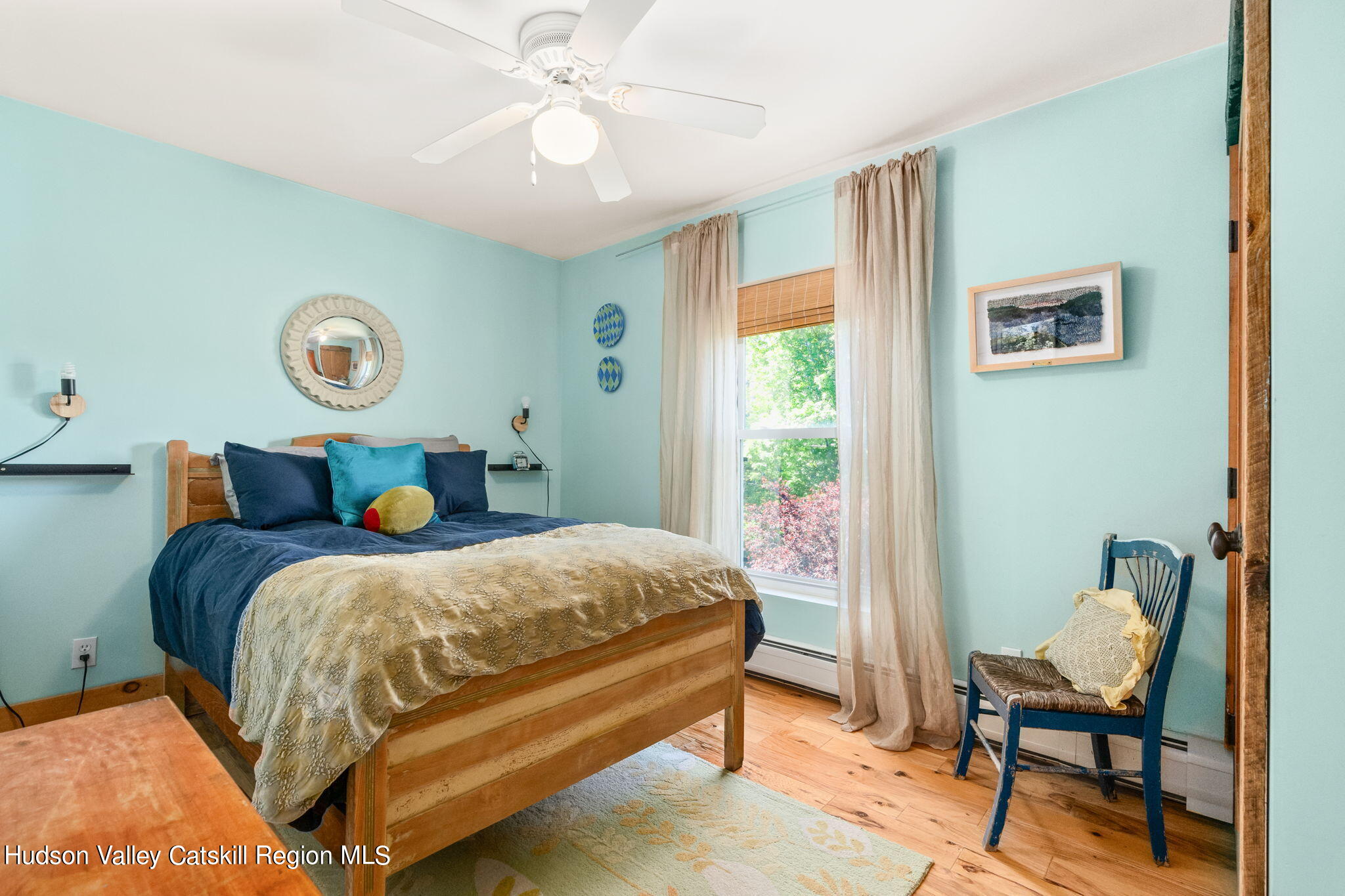 67 Jaycox Road Medusa, NY 12120 - Photo 22 of 36 a bed sitting in a bedroom next to a window