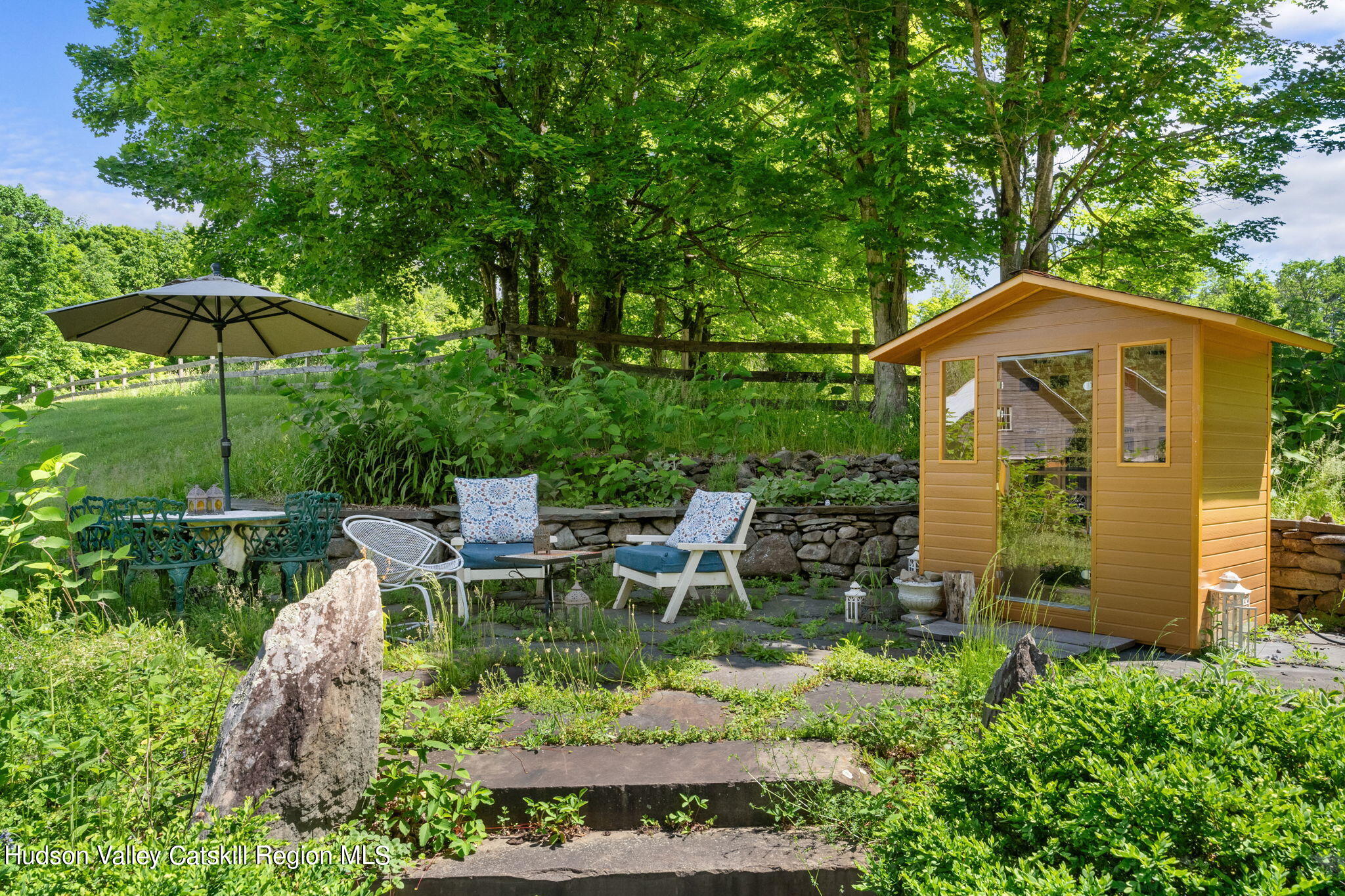67 Jaycox Road Medusa, NY 12120 - Photo 5 of 36 a view of a chair and table under an umbrella