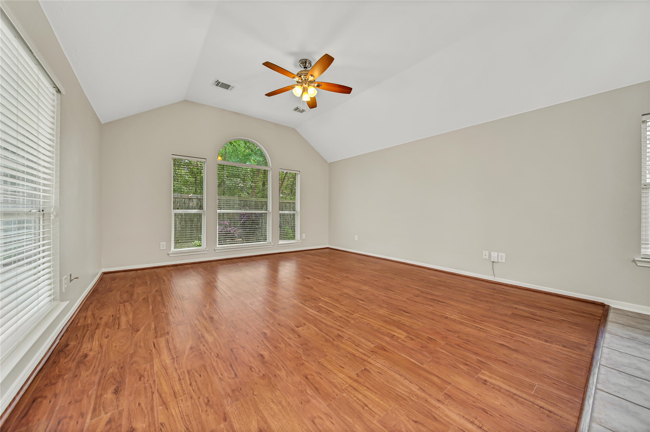 14526 Red Tailed Hawk Lane Houston, TX 77044 - Photo 18 of 40 wooden floor in an empty room with a window