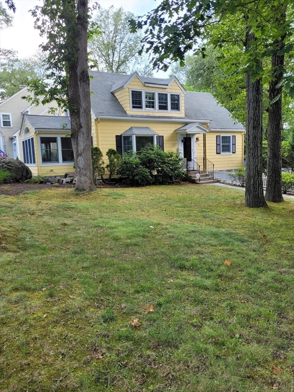 70 Craftsland Road Brookline, MA 02467 - Photo 1 of 16 a front view of a house with a garden