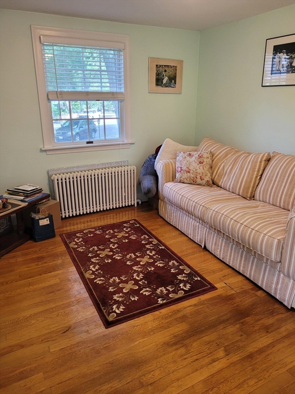 70 Craftsland Road Brookline, MA 02467 - Photo 11 of 16 a living room with a couch and a window