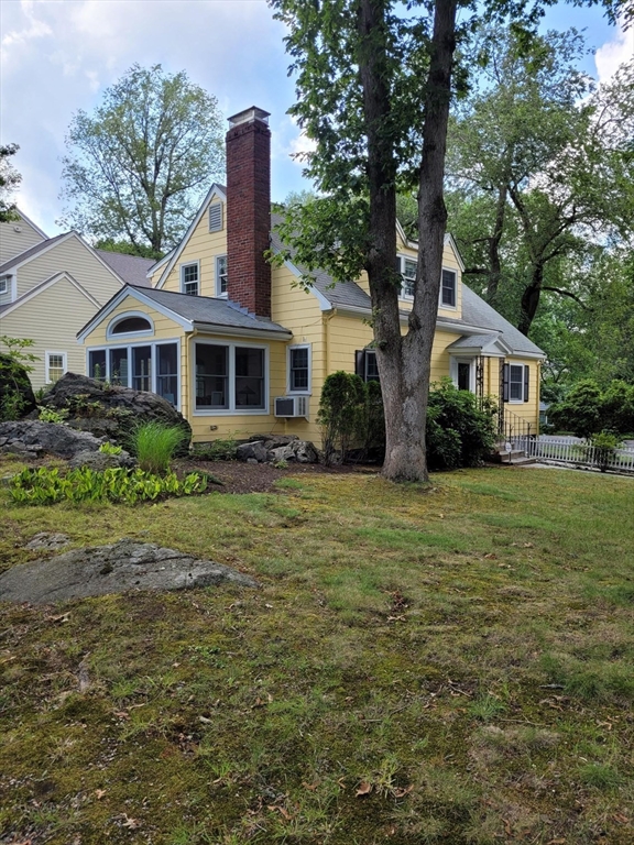 70 Craftsland Road Brookline, MA 02467 - Photo 2 of 16 a front view of house with yard and green space