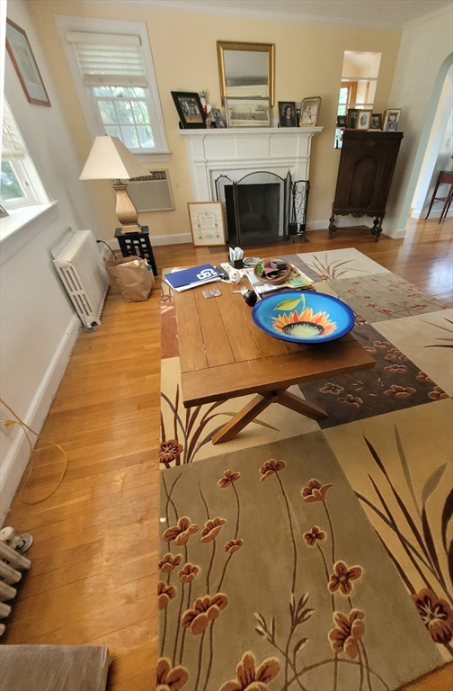 70 Craftsland Road Brookline, MA 02467 - Photo 3 of 16 a living room with furniture and a fireplace
