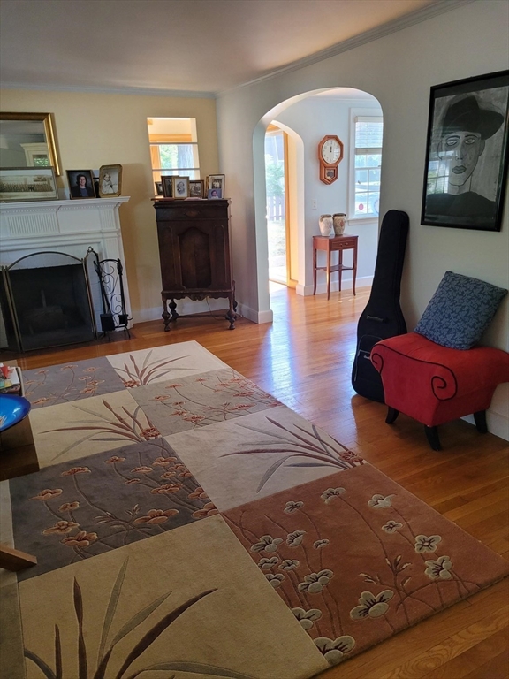 70 Craftsland Road Brookline, MA 02467 - Photo 4 of 16 a living room with furniture and a fireplace