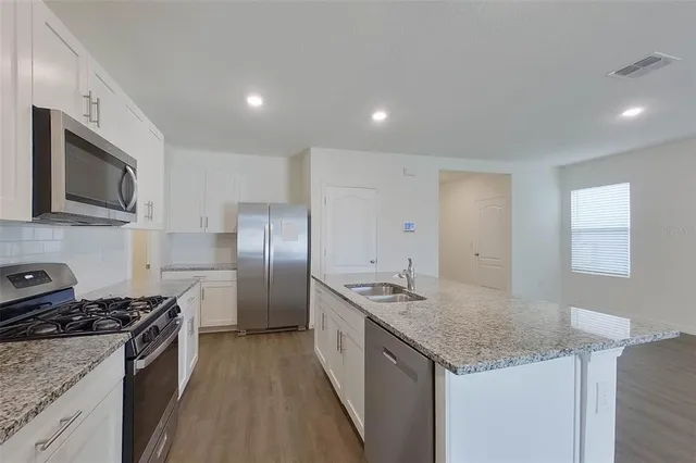 a view of cabinets with wooden floor