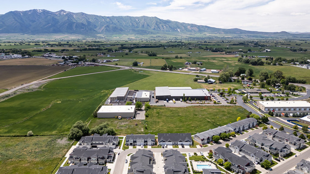 2483 South 1296th Street West Logan, UT 84321 - Photo 39 of 45 Expansive land parcel featuring open green fields and distant mountain ranges