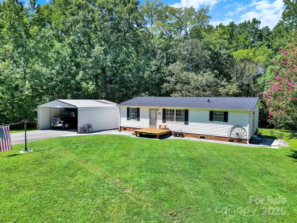 a front view of house with yard and trees