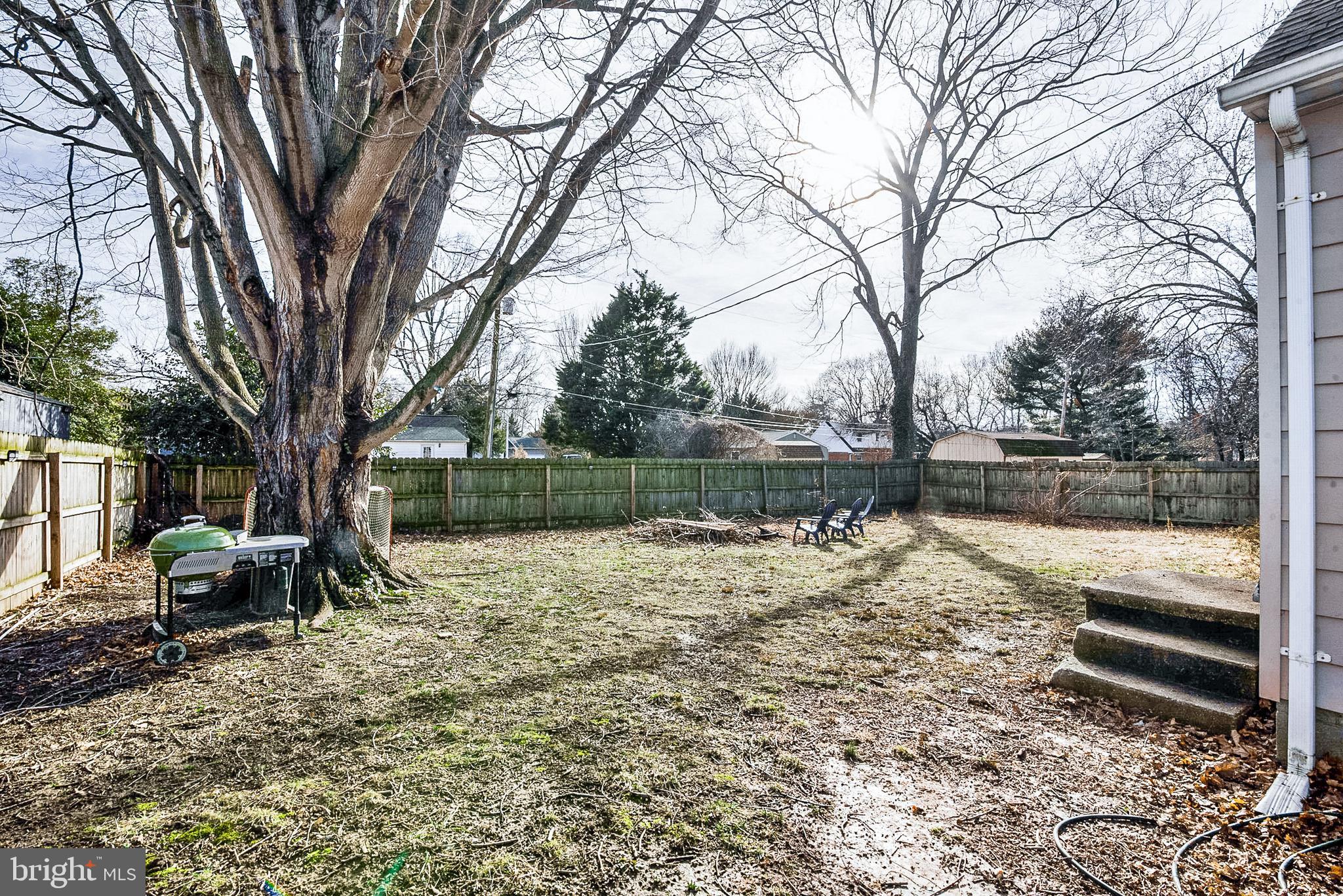 29510 Hawkes Hill Road Easton, MD 21601 - Photo 22 of 32 a lake view with a bench next to a yard