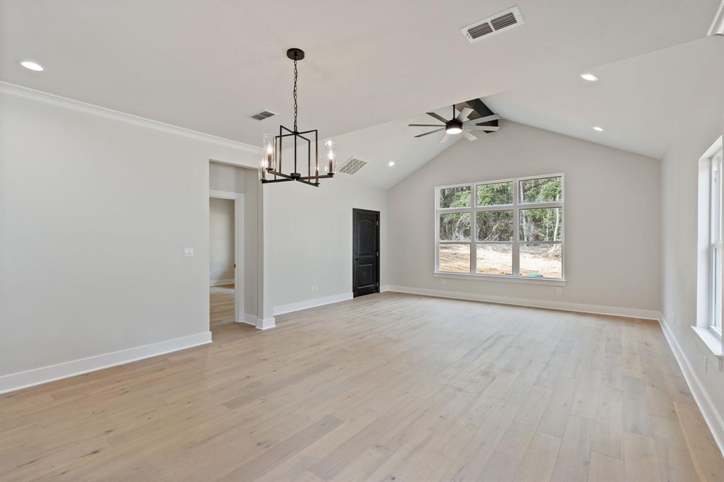 335 Perdanales Bullard, TX 75757 - Photo 17 of 37 an empty room with chandelier fan and windows