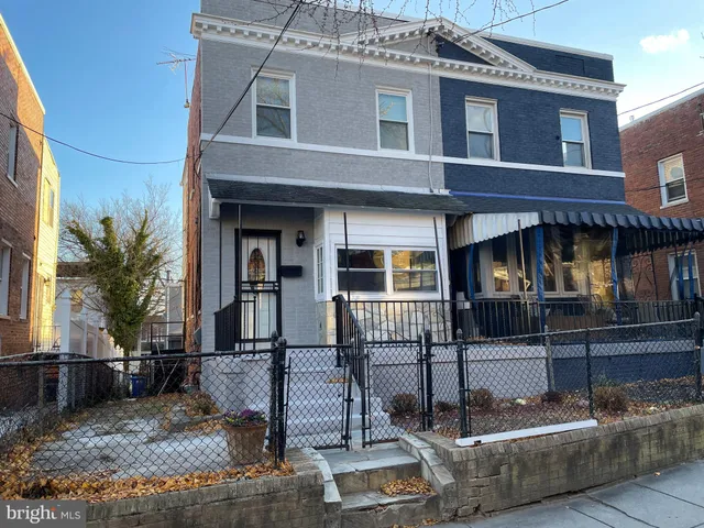 a front view of a house with parking area