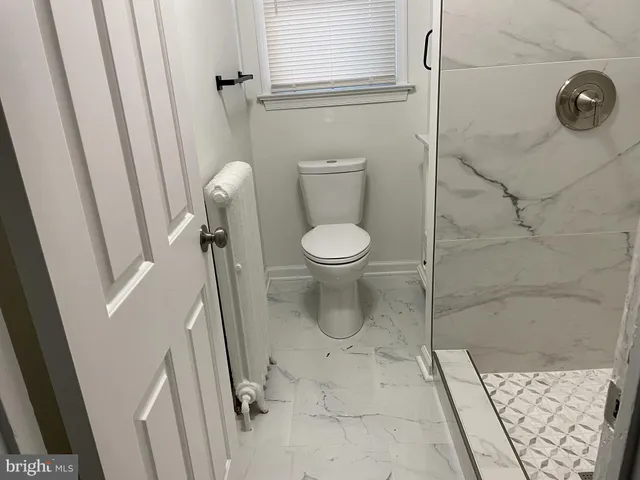 a bathroom with a sink and a window