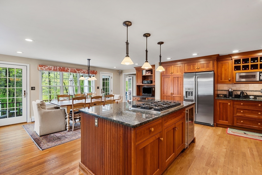 58 High Ridge Road Boxford, MA 01921 - Photo 11 of 40 a kitchen with stainless steel appliances granite countertop a sink stove and refrigerator