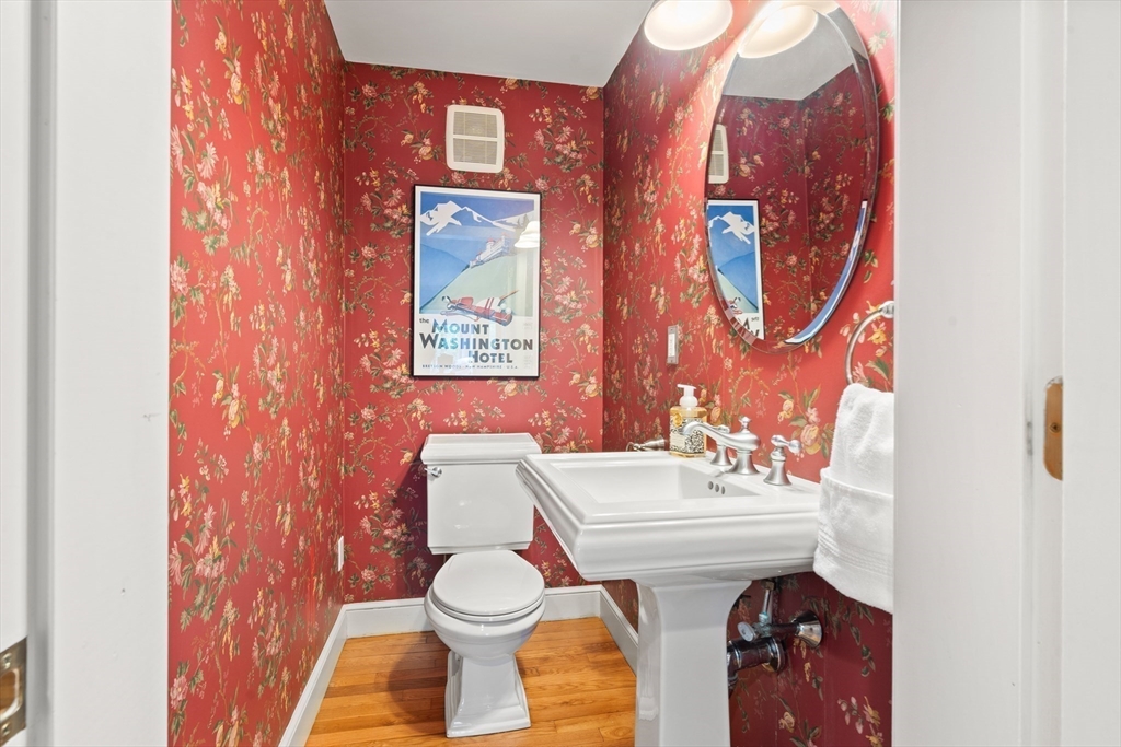 58 High Ridge Road Boxford, MA 01921 - Photo 19 of 40 a bathroom with a toilet sink and mirror