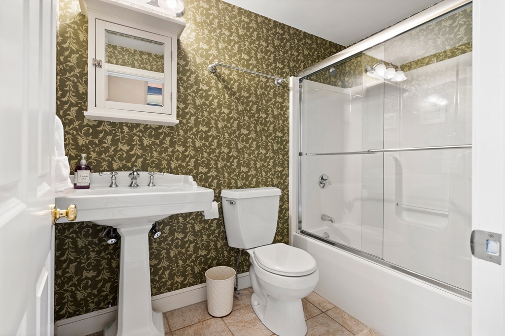 58 High Ridge Road Boxford, MA 01921 - Photo 21 of 40 a bathroom with a sink toilet and shower