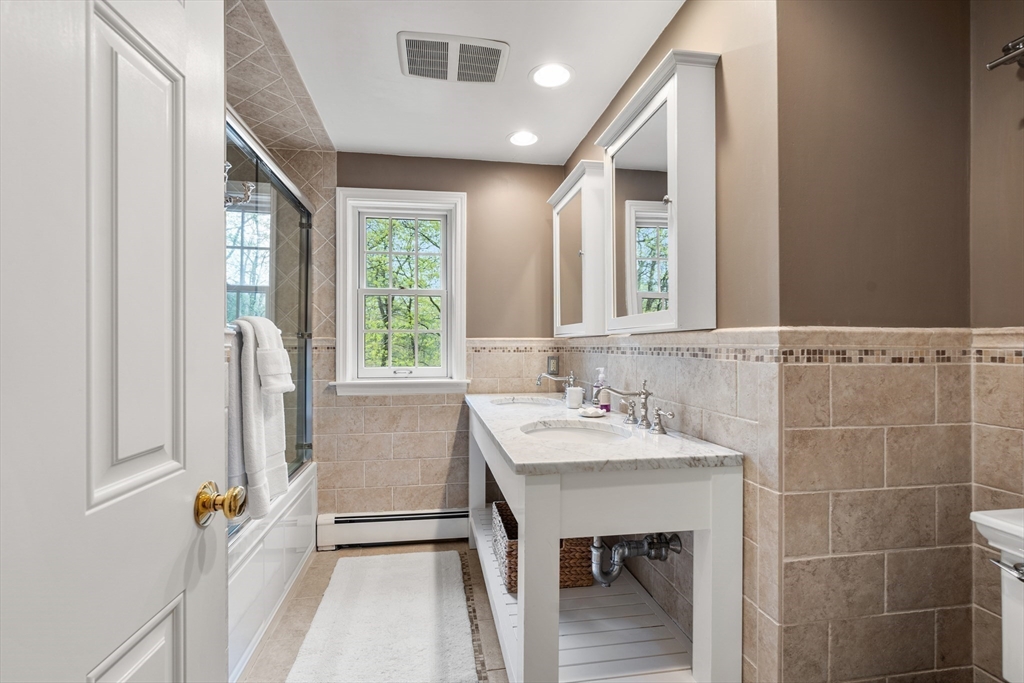 58 High Ridge Road Boxford, MA 01921 - Photo 33 of 40 a bathroom with a sink and a mirror