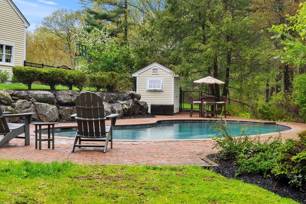 58 High Ridge Road Boxford, MA 01921 - Photo 35 of 40 a front view of a house with garden and sitting area