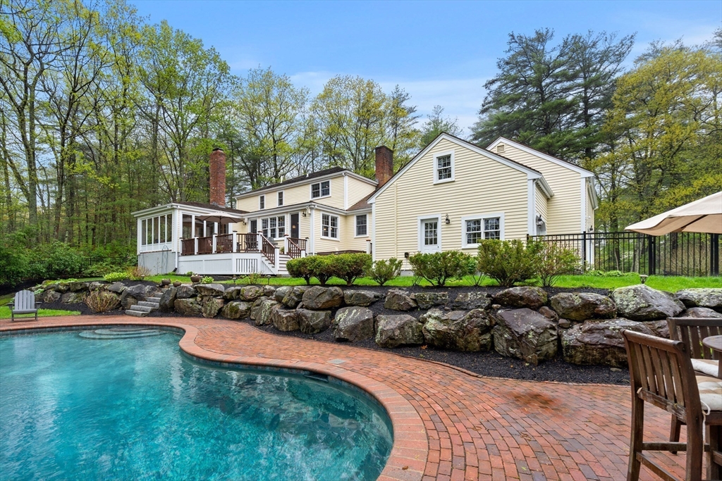 58 High Ridge Road Boxford, MA 01921 - Photo 37 of 40 a front view of a house with a garden