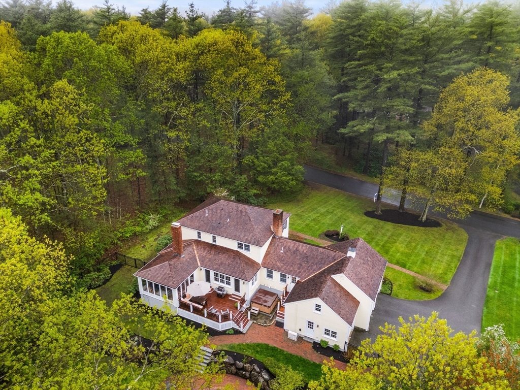 58 High Ridge Road Boxford, MA 01921 - Photo 4 of 40 an aerial view of a house with garden space and trees all around