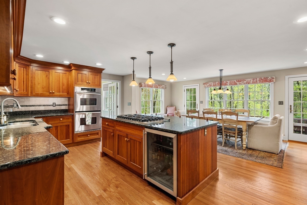 58 High Ridge Road Boxford, MA 01921 - Photo 9 of 40 a kitchen with stainless steel appliances granite countertop sink stove top oven and cabinets
