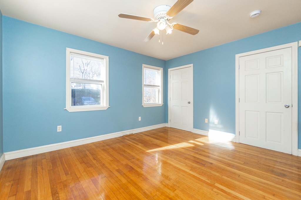 86 Flint Street Salem, MA 01970 - Photo 20 of 30 a bedroom with a large bed and a window
