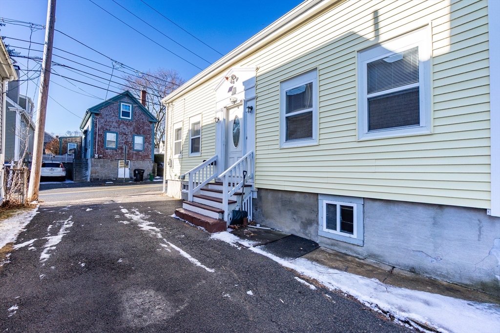 86 Flint Street Salem, MA 01970 - Photo 2 of 30 a view of a house with a yard