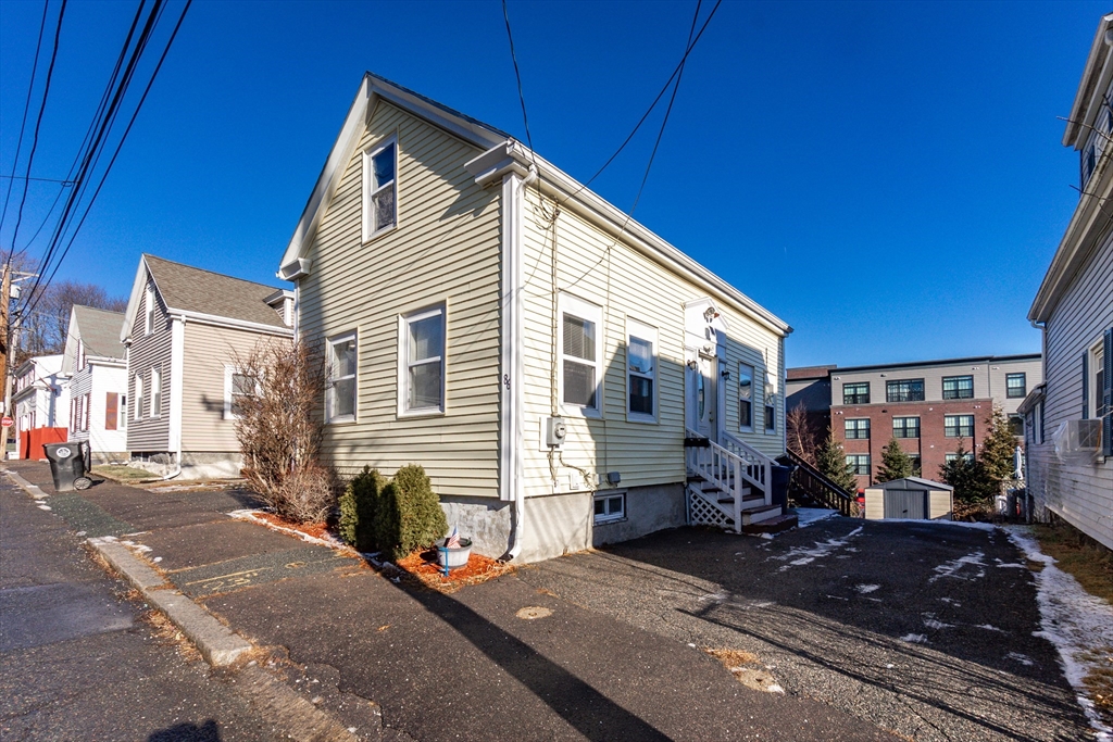 86 Flint Street Salem, MA 01970 - Photo 4 of 30 a view of a house with a patio