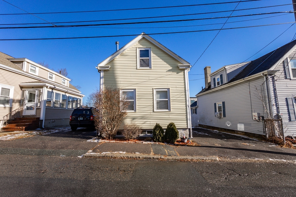 86 Flint Street Salem, MA 01970 - Photo 5 of 30 a front view of a house with a yard
