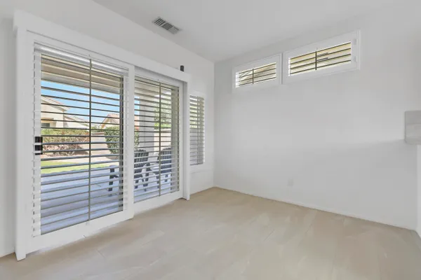 a view of bathroom with a sink and mirror