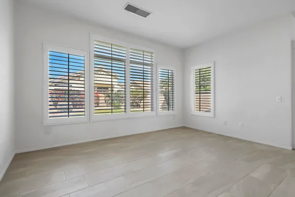 a kitchen with stainless steel appliances granite countertop a sink and a refrigerator